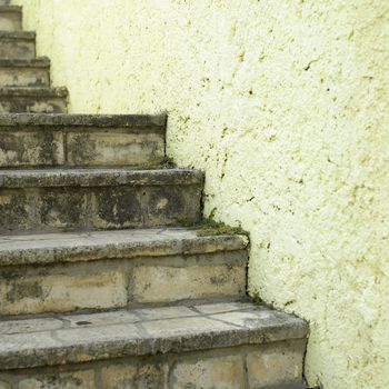 Stone stairs and yellow wall