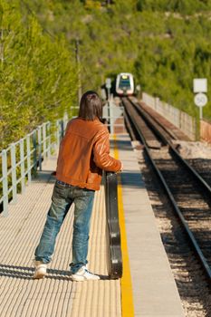 Commuter about to board an arriving train