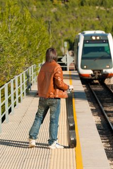 Commuter about to board an arriving train