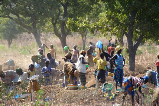 To the goldmine of Poura the gold diggers come from everywhere in the hope of finding a little gold after the season of the cultures. Women, children and men of very old are here in a universe of dust under a blazing sun. In Burkina Faso Faso the research of gold in the wild mines is the only activity which makes it possible to save the population of misery.                             