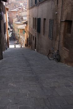 The medieval streets of Siena, in Tuscany, Italy.