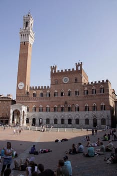 The Torre del Mangia and Palazzo Publico in the Piazza del Campo in Siena, Italy.