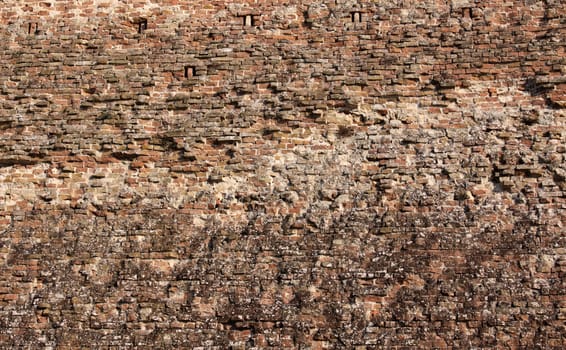 A close-up of a the city walls of the medieval town of Siena, in Tuscany, Italy.
