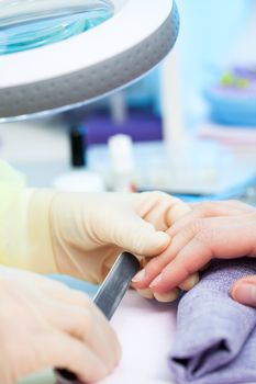 Manicure. Care of fingers of hands, cleaning, covering a varnish of nails.