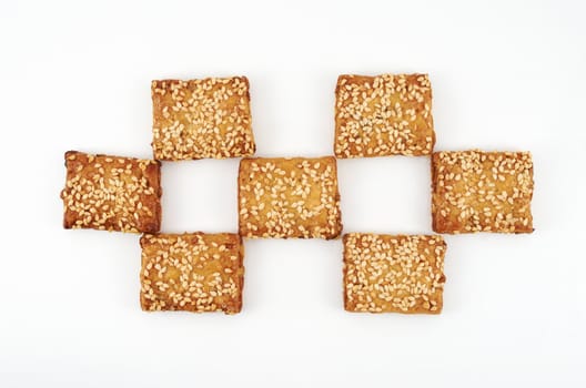 Cookies sprinkled with sesame on a white background