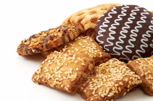 A handful of different cookies on white background