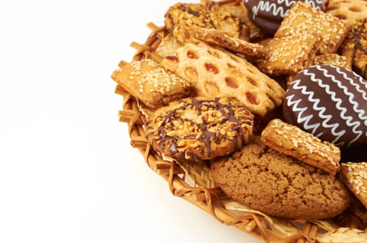 a handful of different cookies on white background