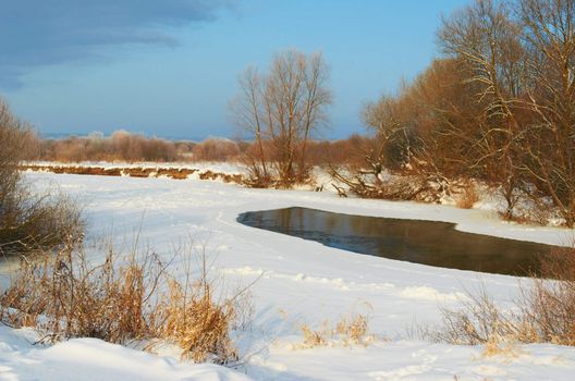 River covered with snow winter frosty morning