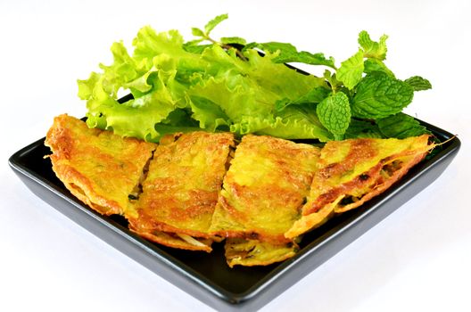 Vietnamese stuffed crispy omelette served with fresh vegetable