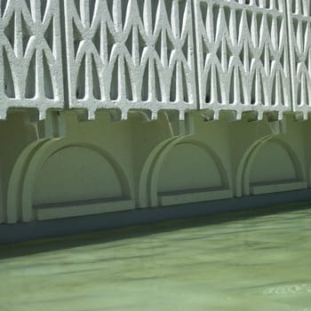 White patterned wall  and water