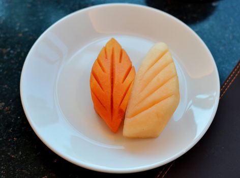 Art carving  fruits , papaya and Yellow honeydew melon