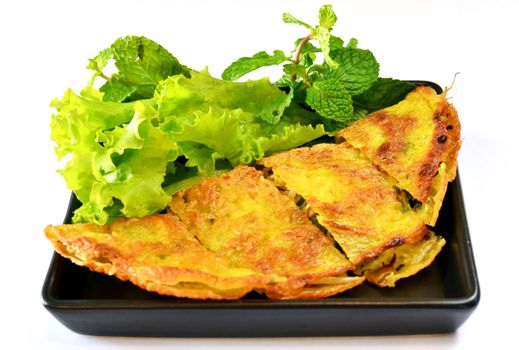 Vietnamese stuffed crispy omelette served with fresh vegetable