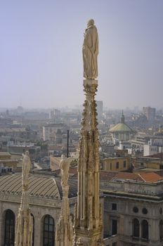 a statue of cathedral in Milan city