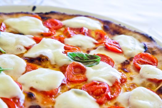 This is a true Italian Pizza. Traditional Pizza Margherita served in a Capri's restaurant, Naples Gulf, Italy.