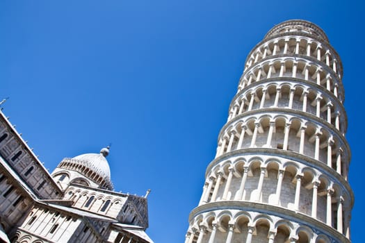 Italy - Pisa. The famous leaning tower on a perfect blue bakcground