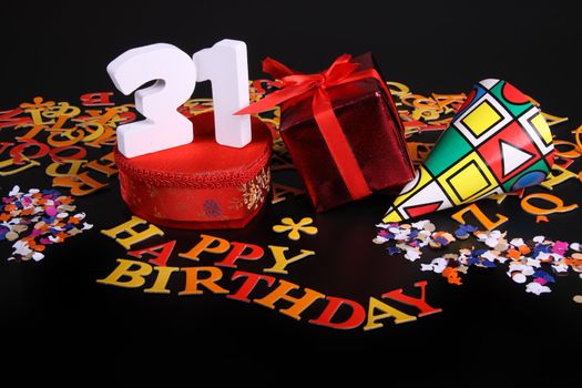 Happy birthday on a black background  and a red heart  and white caracters and confetti