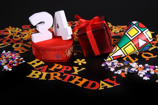 Happy birthday on a black background  and a red heart  and white caracters and confetti