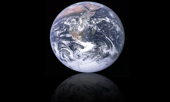 planet earth and its reflection on black