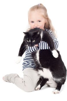 Shot of little cute girl with black cat in studio