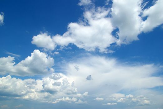 blue sky background with tiny clouds