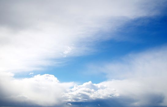 blue sky background with tiny clouds