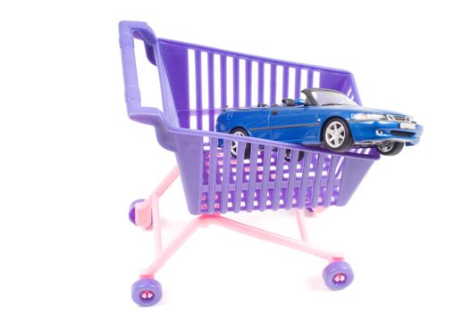 Conceptual photo with car and shopping-cart isolated on white