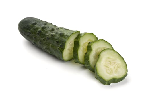Isolated cucumber with slices on the white