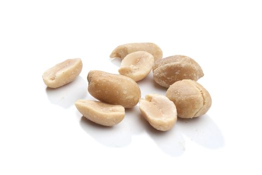 Some peanuts on the white background