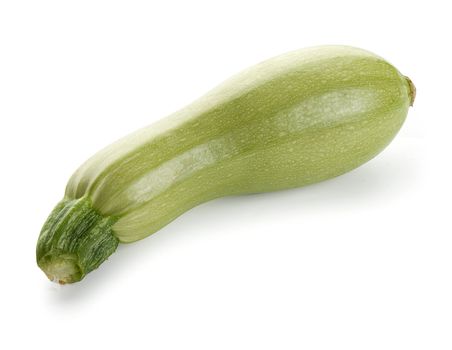 One isolated fresh green marrow sqwash on the white
