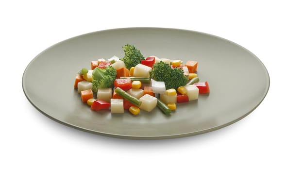 Vegetable mix with potato, paprika, kidney bean, corn, carrot, onion and broccoli on the plate