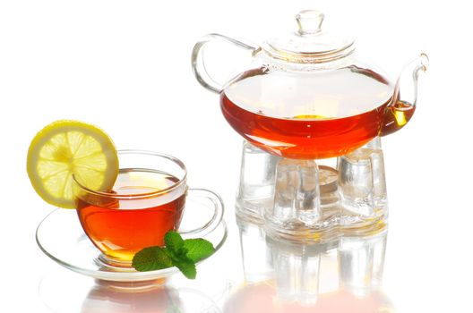 Tea being poured into glass tea cup
