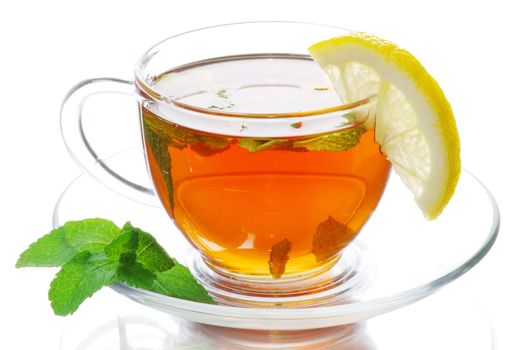 tea in cup with leaf mint and lemon isolated on white background