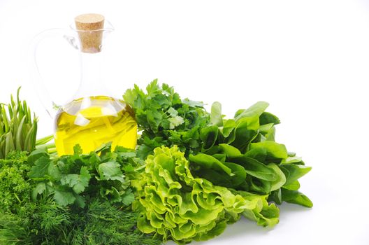 herbs and oil over white