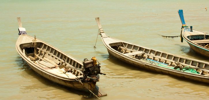 Local fishing boats. Moored in the harbor where the water is not deep.