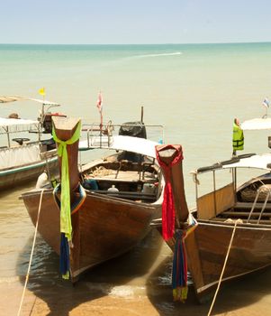 Local fishing boats. Moored in the harbor where the water is not deep.