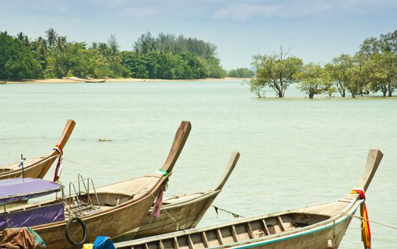 Local fishing boats. Moored in the harbor where the water is not deep.