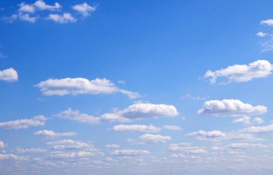 blue sky background with tiny clouds