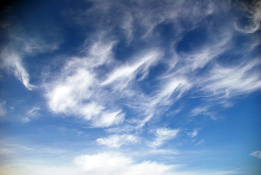 blue sky background with tiny clouds