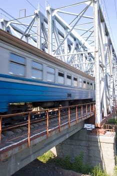 Train. A train the passing railway bridge on the big speed