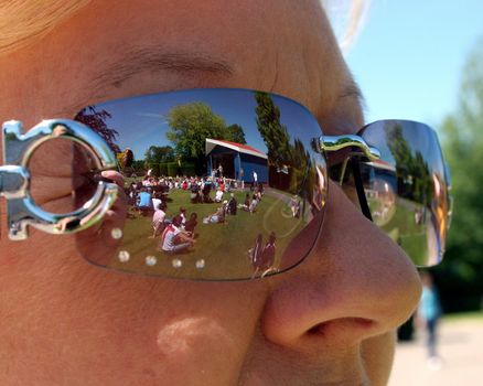 A woman watching a show in a theme park