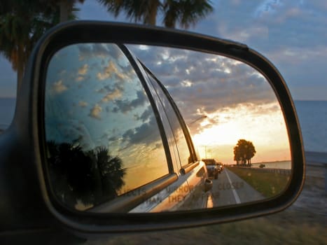 The Reflections of cars and a sunset
