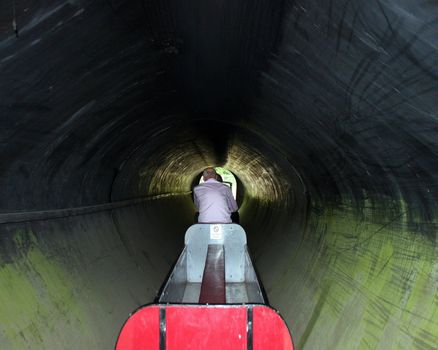 A small train in a tunnel in the UK.