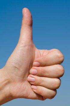 Thumbs up on a blue sky background