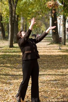 Autumn. Beautiful young woman against autumn park.