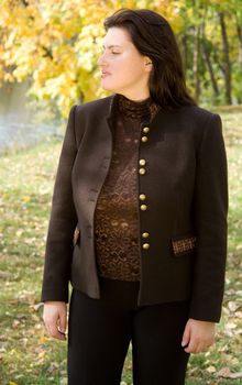 Autumn. Beautiful young woman against autumn park.