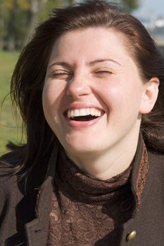 Happiness. The laughing beautiful woman close up.