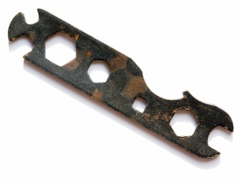 The old bicycle tool on a white background
