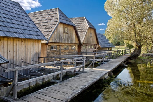 Wooden village on Gacka river source Majerovo vrilo