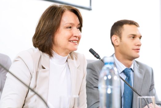 businessmen sitting in a chair at the table, communicate at the conference