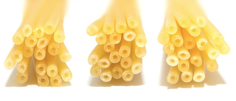 close up of bundles of bucatini pasta noodles